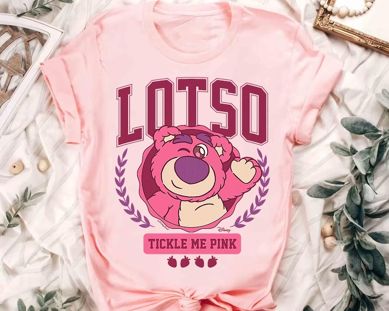a pink t - shirt with the words lotus on it