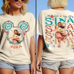 A woman wearing a white t-shirt with a Disney character design and text on the back.