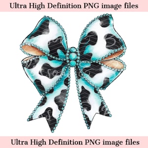 May include: A large turquoise bow with a cow print pattern and rhinestones. The bow is tied in a knot and the ends are curled.