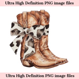 May include: A pair of brown cowboy boots with a white and black cow print bow tied around the tops. The boots are on a white background.