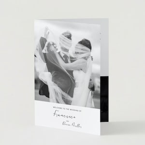 May include: Black and white wedding invitation with a photo of a bride and groom. The text reads "Welcome to the wedding of Francesca and Reece Miller".