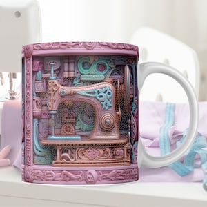 May include: A pink ceramic mug with a detailed illustration of a vintage sewing machine in a decorative frame. The sewing machine is made of metal and has a copper finish. The mug has a white handle.