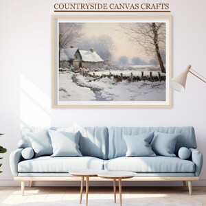 May include: A framed painting depicting a snowy winter scene with a small cottage in the distance. The painting is in a light wood frame and is hanging on a white wall.