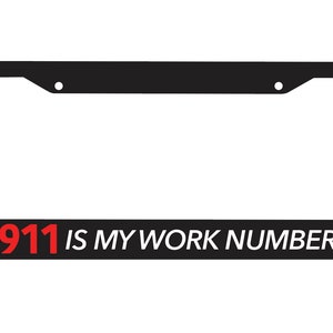May include: Black license plate frame with the text "911 IS MY WORK NUMBER" in red and white.