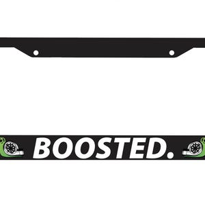 May include: Black license plate frame with a white background and the text "BOOSTED." in white. There are green snail graphics on either side of the text.