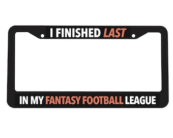 May include: Black license plate frame with white text that reads "I finished last in my fantasy football league".
