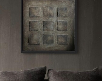 May include: A framed abstract painting with a textured, gray background. The painting is divided into nine squares, each with a slightly different shade of gray.