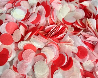 Könnte beinhalten: Ein Haufen roter und weißer Konfetti-Kreise. Das Konfetti besteht aus Seidenpapier und ist perfekt, um jeder Feier eine festliche Note zu verleihen.