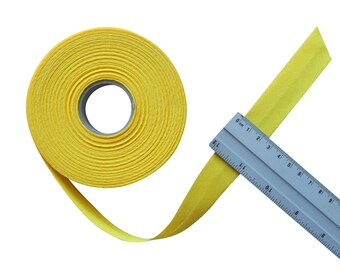 Rol effen geel katoenen biaisband van 25 mm (2,5 cm) breed, voorgevouwen