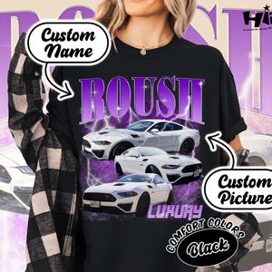May include: Black t-shirt with a graphic of white cars and the word "ROUSH" in purple. The shirt also features text that says "Custom Name", "Custom Picture", "Luxury", "Comfort Colors", and "Black".