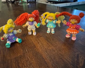 Qty of 4 1985 Cabbage Patch PVC Dolls With Yarn Hair