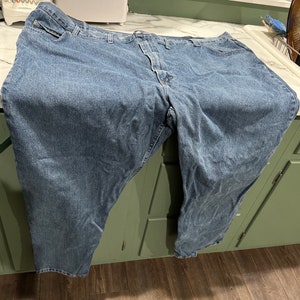 May include: A pair of blue denim jeans with a classic five-pocket style.