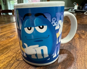 2002 Blue M & M Coffee Mug Pointing and Thumbs Up