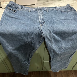 May include: A pair of blue denim jeans with a classic straight leg fit.