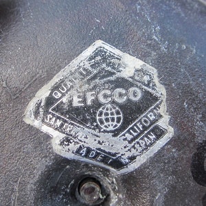 May include: Close-up of a silver sticker with the text "Quality EFC CO San Francisco California Made in Japan" and a globe graphic.