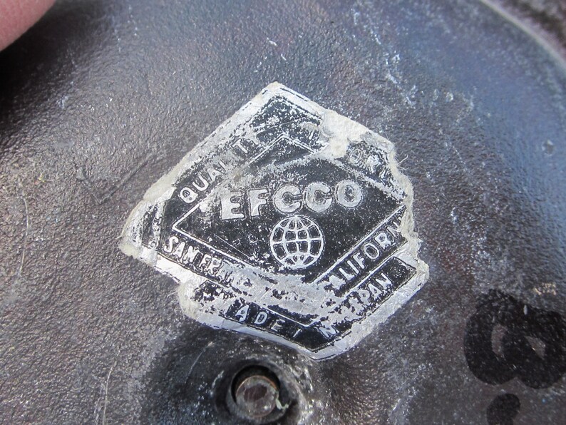 May include: Close-up of a silver sticker with the text "Quality EFC CO San Francisco California Made in Japan" and a globe graphic.