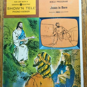 Puede incluir: Una portada de álbum de disco vintage para el programa bíblico Canon, con una ilustración colorida de la escena de la Natividad. El álbum se titula "Jesús ha nacido" y forma parte de la serie "Show 'n Tell" para usar con un Phono-Viewer General Electric.