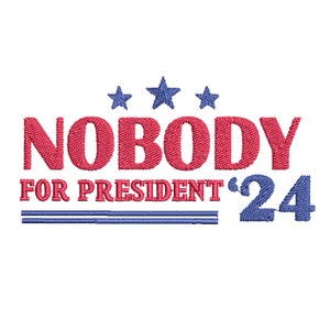 May include: Red text on a white background reads "NOBODY FOR PRESIDENT '24". Above the text are three blue stars. Below the text are two blue lines.