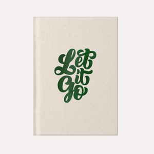 May include: A canvas notebook with the text "Let it Go" written in green cursive lettering.