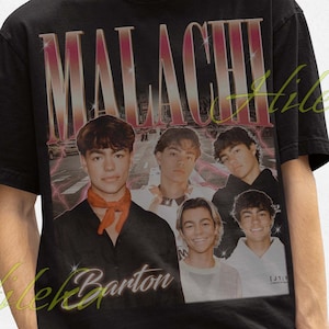 May include: Black t-shirt with the word "MALACHI" in a gradient font and a group of young men. The shirt also has the name "Hileka Barton" in a cursive font. The person in the image is wearing a black bucket hat.