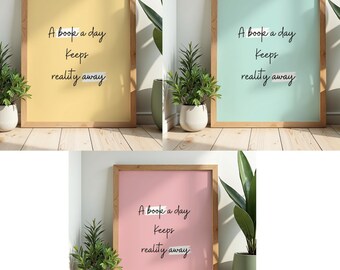 May include: Three framed wall art prints in yellow, light blue, and pink, each featuring the black text A book a day Keeps reality away with white highlight accents. The prints are displayed in light wood frames with a clean, simple design.