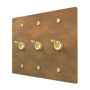 Płytki przełączników kołyskowych, ściemniaczy i gniazdek w stylu retro - wykończenie w kolorze postarzanego mosiądzu do oświetlenia domowego