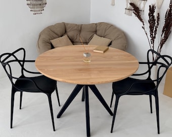 Round Solid Wood Dining Table with Black X Base Scandinavian Modern Pedestal Design