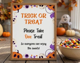 May include: A rectangular wooden frame containing a white sign with orange and black text that reads: TRICK OR TREAT, Please Take One Treat, So everyone can enjoy the sweets! The border features illustrations of pumpkins, skulls, and candy.