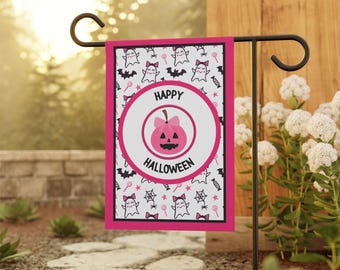 May include: A Halloween garden flag with a pink border. The flag features a white background with a pattern of ghosts, bats, and candy. A pink pumpkin with a bow is in the center, with the words "Happy Halloween" around it.