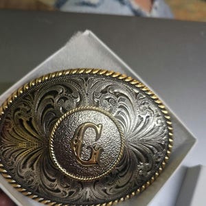 G initial belt buckle unbranded undated