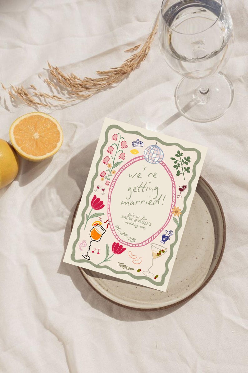 May include: A rectangular wedding invitation card featuring a wavy green border and a central pink oval frame. The text reads we're getting married! Join us for Nadia & Chad's wedding day 06.30.25. Illustrations include a disco ball, flowers, and cocktails.