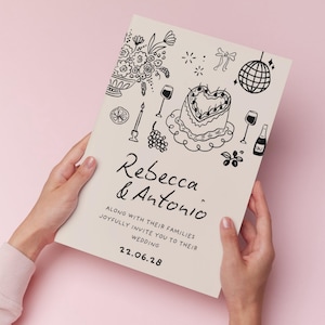 K&ouml;nnte beinhalten: Eine rechteckige Hochzeitseinladungskarte in Creme mit schwarzen Strichzeichnungen eines herzf&ouml;rmigen Kuchens, einer Discokugel, Blumen und Weingl&auml;sern. Der Text lautet Rebecca & Antonio along with their families joyfully invite you to their wedding 22.06.28.