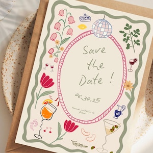 May include: A cream-colored invitation card with a brown envelope. The card features a pink oval frame with the words "Save the Date!" and the date "06.30.25". Floral and cocktail illustrations surround the text.