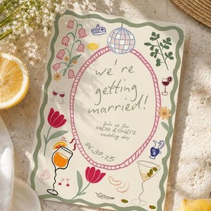 May include: A rectangular wedding invitation card with a cream background and a wavy green border. The center features a pink oval frame containing the text 'we're getting married!', 'join us for NADIA & CHAD'S wedding day', and '06.30.25'.