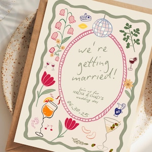 May include: A cream-colored wedding invitation card with a wavy green border, featuring illustrations of a disco ball, flowers, cocktails, and shrimp. The text reads: we're getting married! Join us for NADIA & CHAD'S wedding day 06.30.25.