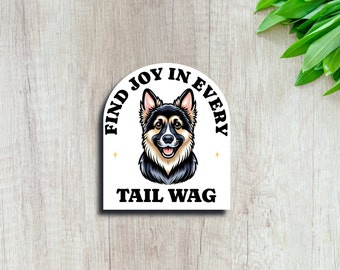May include: White sticker with a black and tan German Shepherd dog illustration. The text reads "Find joy in every tail wag."