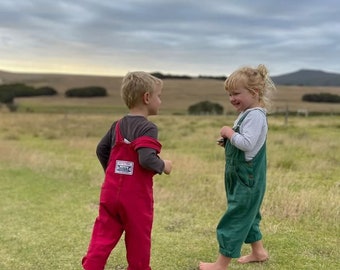 Vintage kids overalls in red cotton twill with cute patch detail at the back