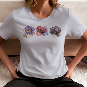 Bohemian Flower Tshirt Watercolor Design Botanical Artwork Floral Pattern Delicate Blooms Purple Blue Accents Cottagecore Aesthetic Feminine Fashion Trendy Apparel Garden Inspired Nature Theme Beautiful Illustration Comfortable Cotton