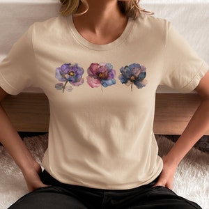 Comfortable Cotton Fabric Bohemian Flower Tshirt Watercolor Design Botanical Artwork Cottagecore Aesthetic Feminine Fashion Trendy Apparel Garden Inspired Nature Theme Beautiful Illustration Delicate Blooms Purple Blue Accents Gold Detail