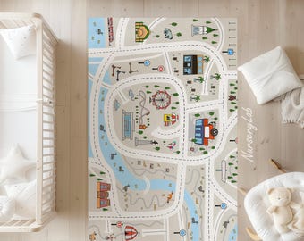 Puede incluir: Una colorida alfombra de juego que presenta una escena de ciudad con caminos, edificios, una noria y un autobús. La alfombra está diseñada para que los niños jueguen en ella y presenta el texto "Nursery Lab".
