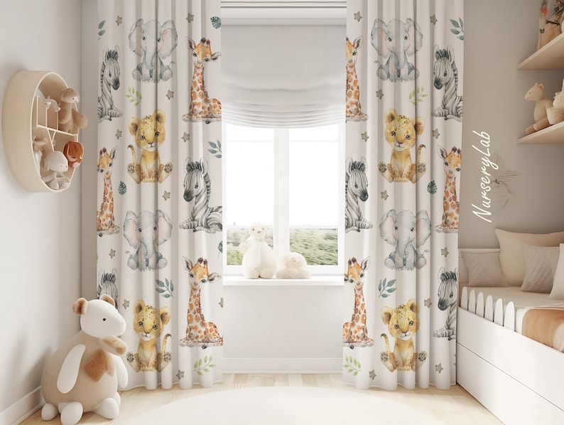 May include: Off-white curtains featuring a repeating watercolor pattern of baby animals including elephants, giraffes, zebras, and lions. The design includes small green leaves and grey stars scattered between the animals. The text NurseryLab is visible.