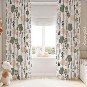 May include: White curtains with a repeating pattern of green, brown, and blue trees. The curtains are hung in a nursery with a white crib and a wooden shelf with stuffed animals.