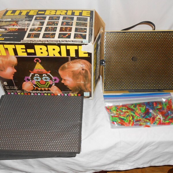 LITE-BRITE Toy, by HASBRO 1981, in box + pegs + used and some new sheets  Tested and working!