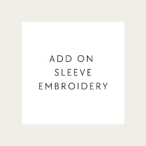 May include: Add on sleeve embroidery text on a white background.