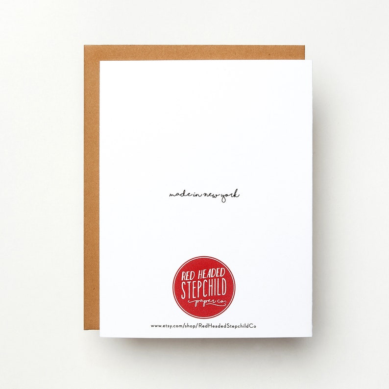 May include: A white card with the text "made in new york" and a red circle logo that says "Red Headed Stepchild Paper Co." and the website address "www.etsy.com/shop/RedheadedStepchildCo".