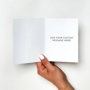May include: A blank white card with the text "ADD YOUR CUSTOM MESSAGE HERE!" printed in black on the inside.
