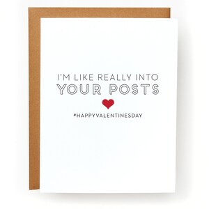 May include: A white card with black text that reads "I'm like really into your posts" with a red heart symbol below the text and the hashtag "#HappyValentinesDay" below the heart.