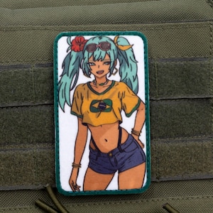 May include: A green and yellow patch with a cartoon image of a woman with green hair wearing a yellow shirt with a green and blue symbol and blue denim shorts. The woman is wearing sunglasses and a flower in her hair.