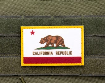 May include: A yellow, red and white patch with a brown bear and the text "CALIFORNIA REPUBLIC".
