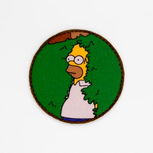 Homer Simpson gömmer sig i bushen med kardborreband och moralpatch bild 5